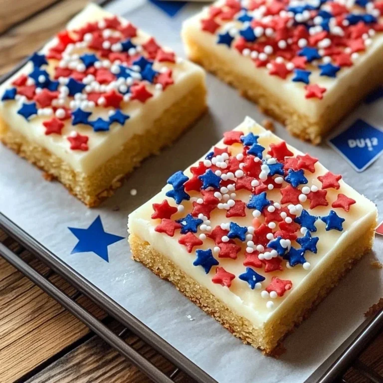 Irresistible patriotic sugar cookie bars decorated with red, white, and blue frosting